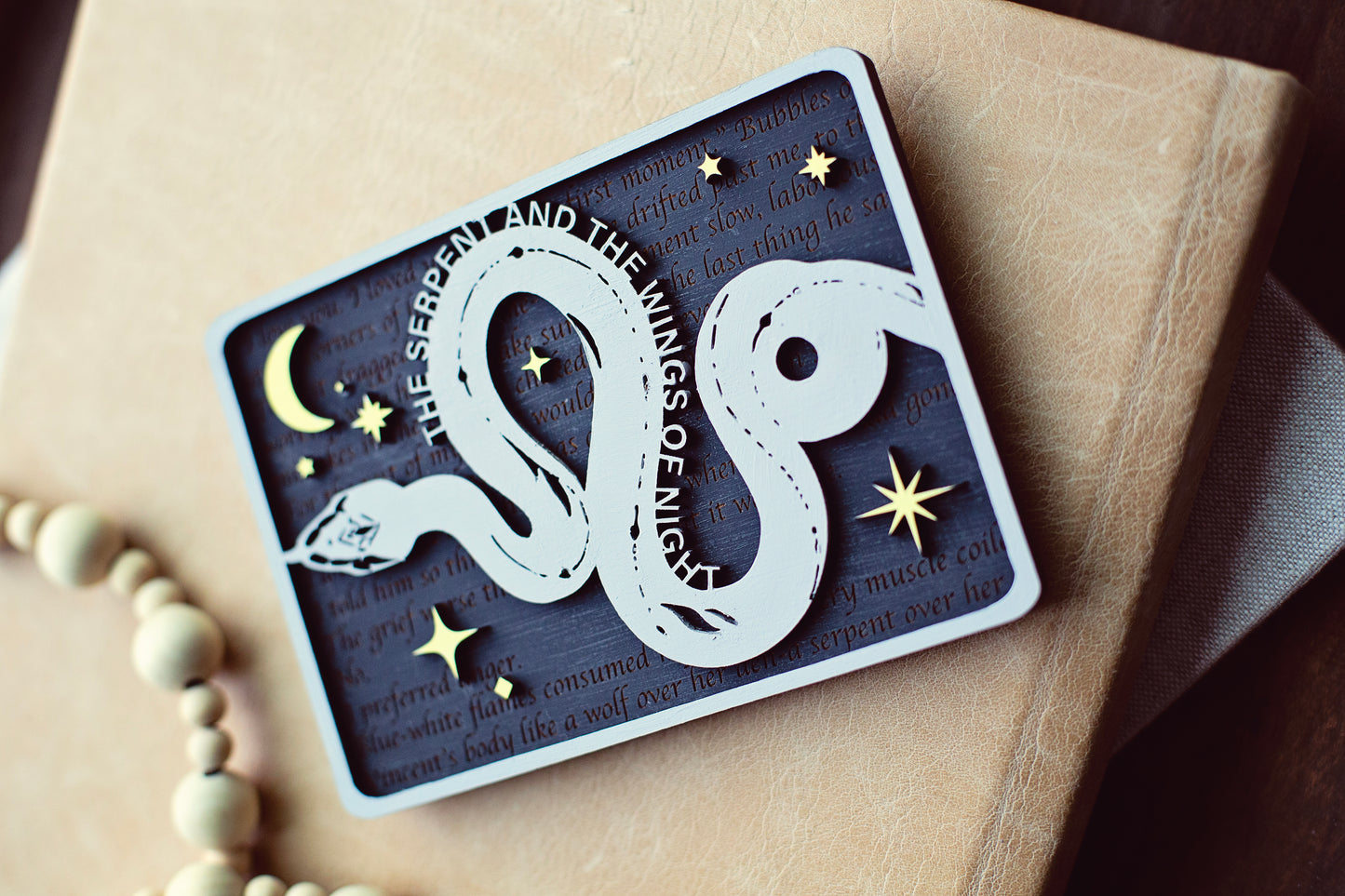 Serpent and the Wings of Night Bookshelf Sign